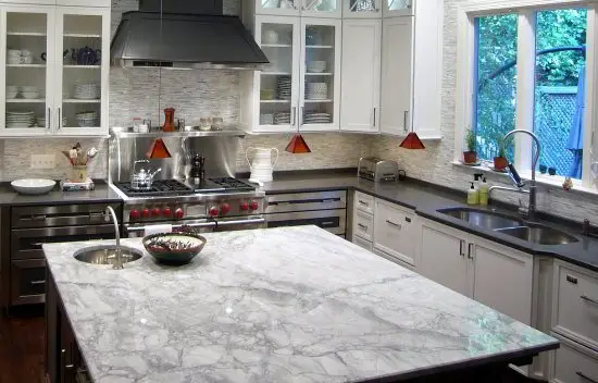 white fantasy quartzite kitchen island countertop looks like carrara marble