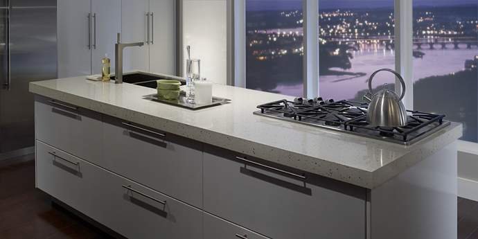 zodiaq quartz countertop on kitchen island in urban loft with city view