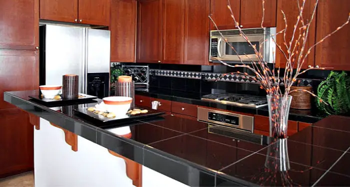 black granite tile countertops in a large kitchen