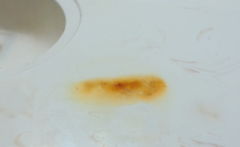 burn mark on cultured marble countertop from curling iron