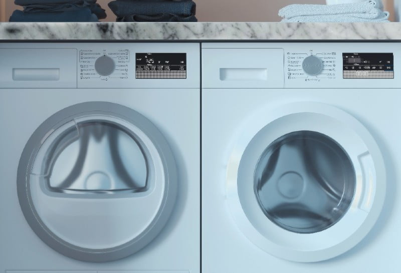 white carrara marble countertops over washer and dryer in laundry room