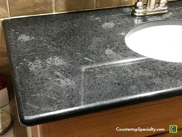 cloudy blotches gray Silestone from cleaner damage