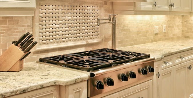 new white granite countertops installed kitchen with tile backsplash