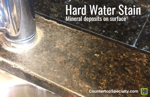 hard water stains on kitchen countertop around faucet
