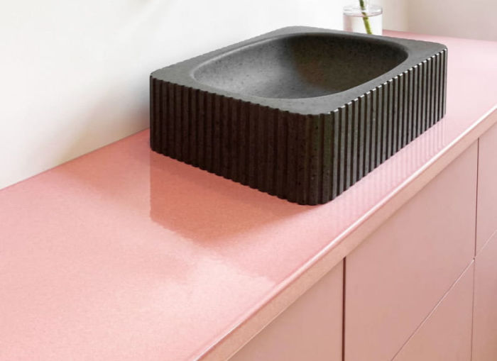lava stone countertops - pink vanity with black lava sink