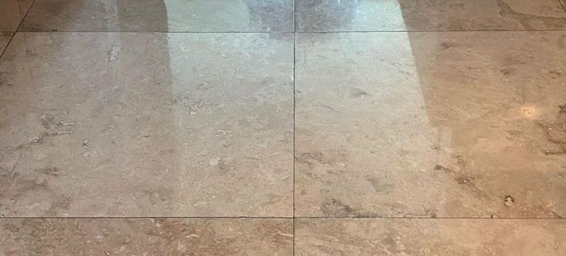 polished travertine finish on tile flooring