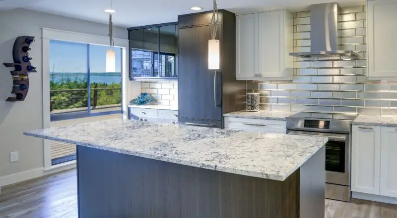 White quartz countertops with blue veins like marble in modern open kitchen