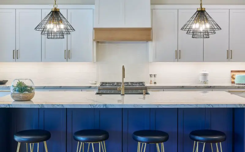 quartz-vs-quartzite-countertops-on-blue-kitchen-island-white-cabinets-800-min.jpg