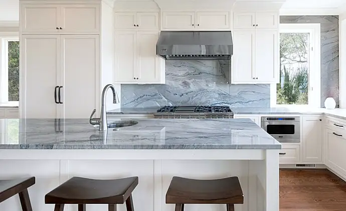 blue macaubus quartzite countertops on kitchen island and backsplash