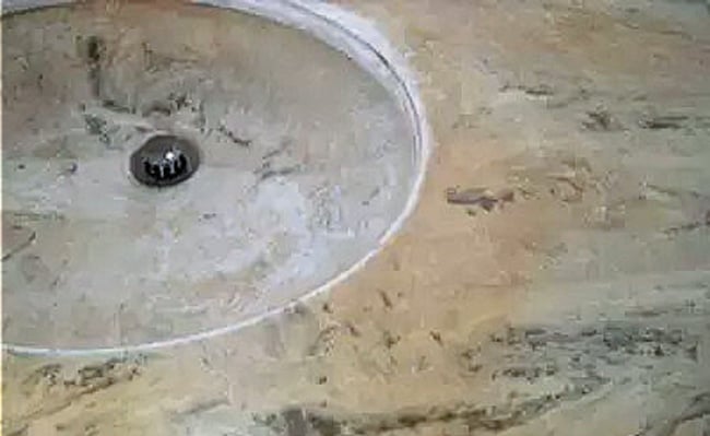 cultured marble repair: vanity top and sink prepared for polishing