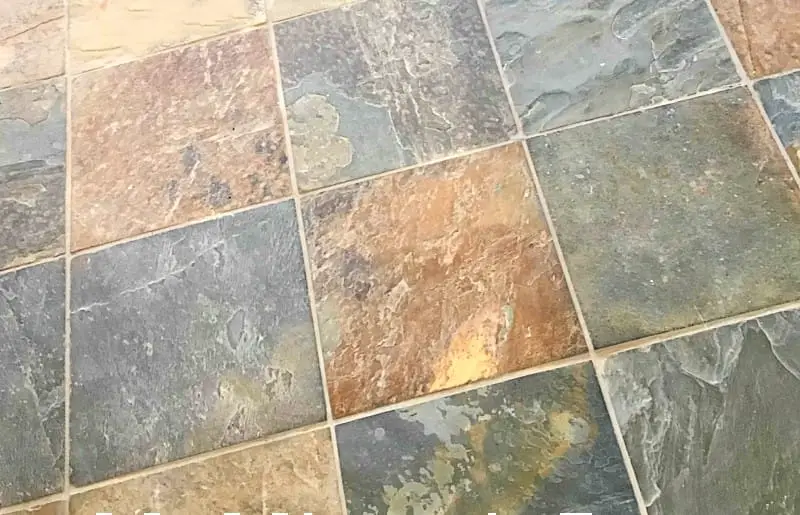 colorful slate floor tile in gold, green, rust, and tan