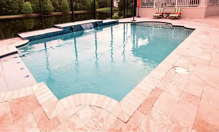 travertine paver pool deck and coping around swimming pool