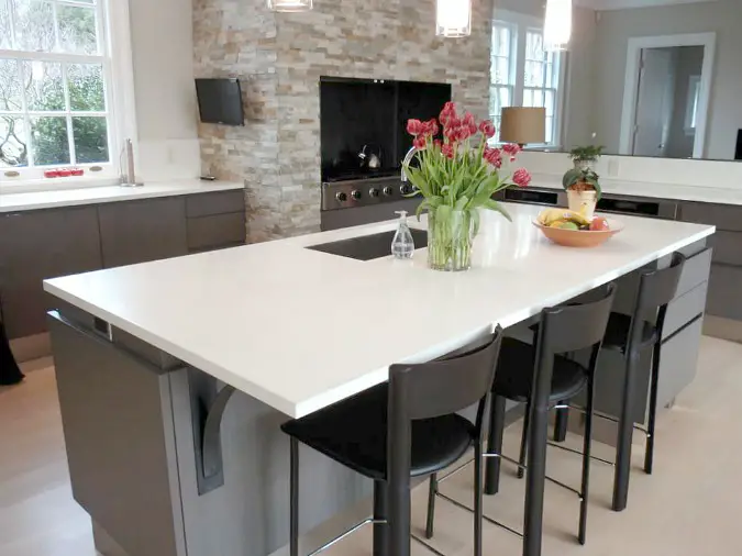 white concrete countertops on kitchen island in modern open kitchen design