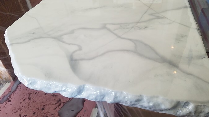 white epoxy countertops that look like marble with a chiseled edge