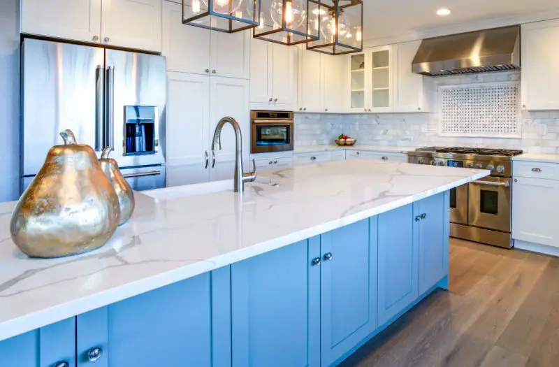 quartz countertops that look like white marble in large luxury kitchen