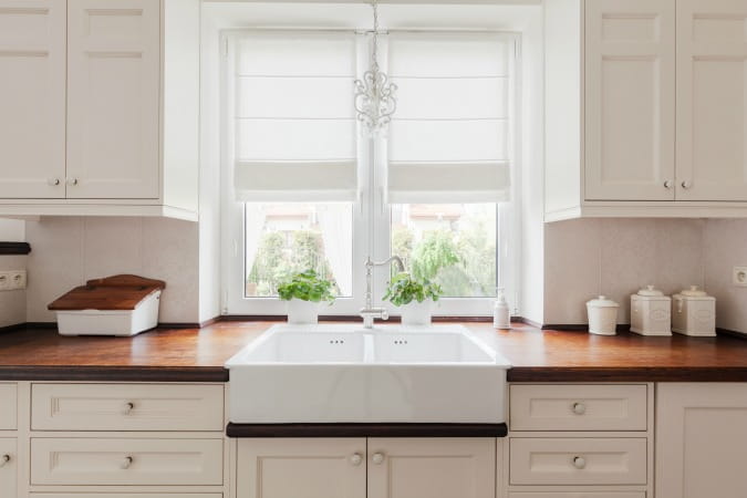 wood countertops farmhouse sink white cabinets